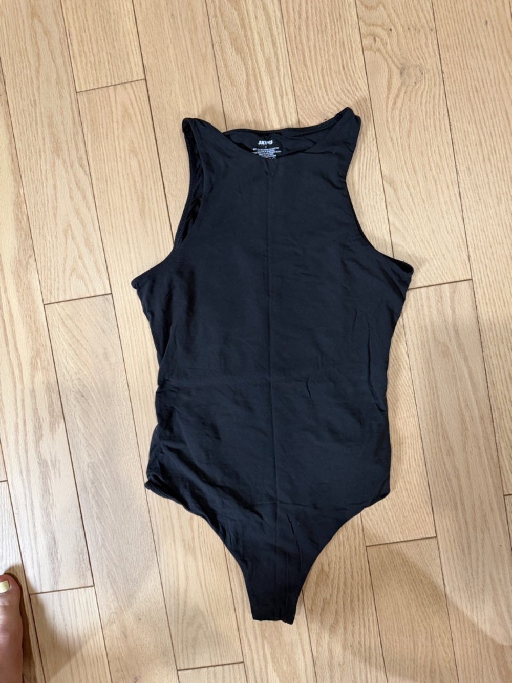 SKIMS Black Sleeveless One-Piece Bodysuit